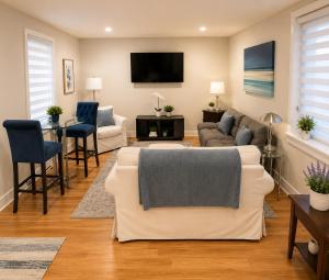 a living room with a couch and a tv at CrazyHart PVD in Providence