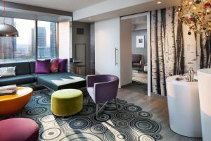 a living room with a couch and a table at W Bellevue in Bellevue +59 photos