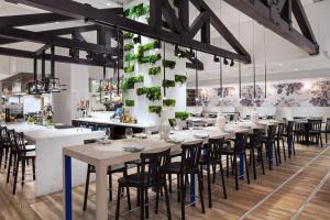 a large dining room with tables and chairs at W Bellevue in Bellevue