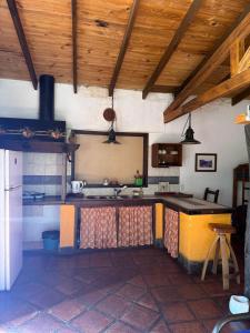 a kitchen with a counter top in a room at Ashpa apart in Cafayate