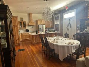 a kitchen with a table with chairs and a dining room at Catherine's Palace in Vicksburg
