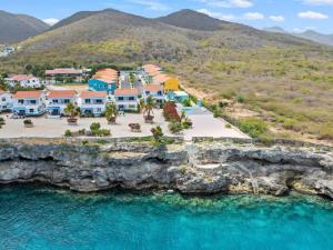an aerial view of a resort on a rocky coast at Serene Shores, Punta Azul, Westpunt in Westpunt