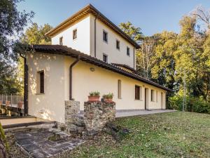 a white house with trees in the background at Mansion in Citerna with Pool & Garden in Citerna