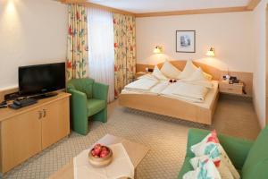 En eller flere senge i et værelse på Hotel Jagdhof Bed & Breakfast