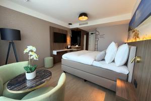 a hotel room with a bed and a table at TRYP Badhotel The Hague Scheveningen BRAND NEW in Scheveningen +59 photos