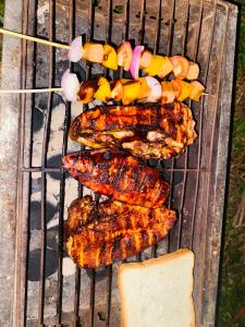 a group of grilled meat and vegetables on a grill at The Forest Edge Resort in Dambulla +51 photos