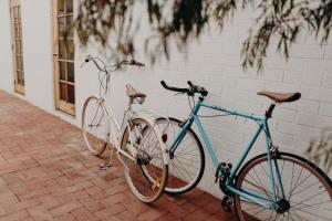 two bikes are parked next to a wall at Balnagown in Albany