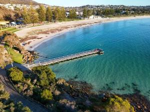 an aerial view of a pier next to a beach at Balnagown in Albany