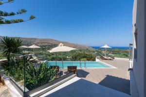 a view of a swimming pool from a house at Villa Dorothea in Georgioupoli