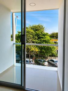 a window with a view of a parking lot at Hotel Don Felipe in Ríohacha