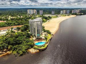 an aerial view of a building next to a beach at Flat Tropical Hotel Vista Espetacular in Manaus