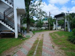 an empty yard next to a building with a staircase at The Grand Villa Malabe in Malabe +9 photos