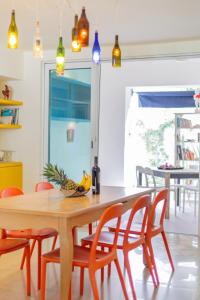 a dining room with a wooden table and chairs at Casa Mila in La Paz