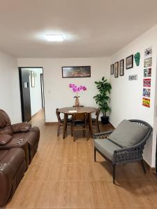 a living room with a couch and a table at Las Minervas in Monterrey