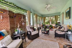 a living room with a couch and chairs at Abi's House - Private Jupiter Escape in Jupiter