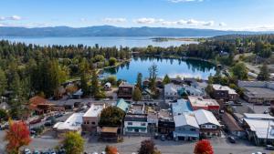 an aerial view of a small town next to a lake at The Cottages at Bigfork in Bigfork