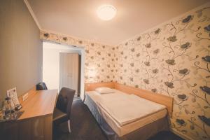 
Łóżko lub łóżka w pokoju w obiekcie Pokoje gościnne Truskawkowa 1a
