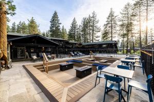 a patio with tables and chairs and a building at The Iceberg Tahoe in South Lake Tahoe