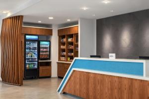a bar in a restaurant with a drink refrigerator at SpringHill Suites by Marriott Dayton Vandalia in Murlin Heights +36 photos