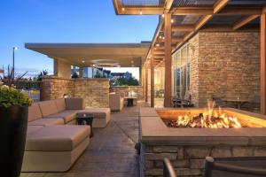 an outdoor patio with a fire pit and furniture at SpringHill Suites by Marriott Dayton Vandalia in Murlin Heights
