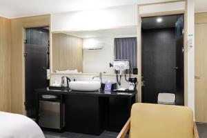a bathroom with a sink and a mirror at 서천 마리 호텔 in Seocheon +72 photos