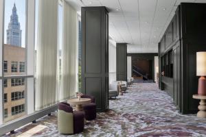 a hallway with chairs and tables in a building at The Westin Cleveland Downtown in Cleveland