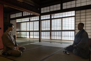two people sitting on the floor in a room with windows at Sowaka in Kyoto +199 photos