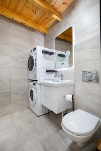 a bathroom with a sink and a washing machine at The 2D Stay in Theológos +15 photos