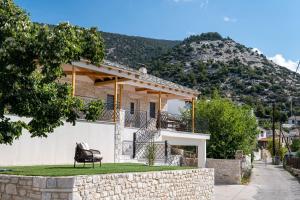 a house in front of a mountain at The 2D Stay in Theológos