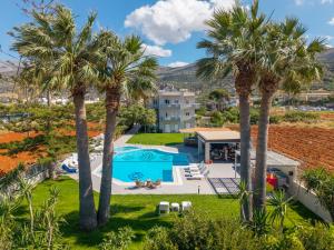 an aerial view of a resort with palm trees at Matthew's Place in Malia