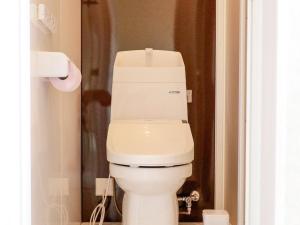 a bathroom with a white toilet in a room at ホテルステイ伊万里 in Imari