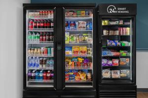 a refrigerator filled with lots of food and drinks at StudioRes by Marriott LaGrange in La Grange