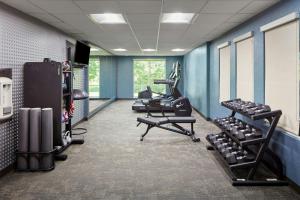 a gym with several tread machines in a room at Fairfield Inn & Suites Cleveland Avon in Avon