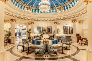 a lobby with a domed ceiling with a chandelier at Hotel Fénix, a Gran Meliá Hotel - The Leading Hotels of the World in Madrid