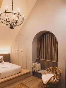 a bedroom with a bed and a chandelier at Oxygen Cloud Khaoyai Managed by OHS in Ban Bung Toei +177 photos