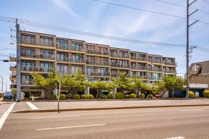 a large building on a street with a road at Ocean Side Beach Condo in Ocean City
