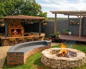 a backyard with a fire pit and a pergola at Perdekuil in Stilbaai-Wes