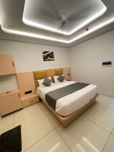 a bedroom with a large bed in a room at Hotel hills in Ahmedabad