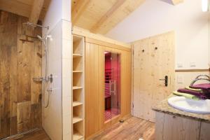 a bathroom with a shower and a sink at Chalet am Müllergut in Sankt Martin bei Lofer +20 photos