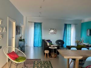 a living room with a couch and a table at Casa verde in Tuzla
