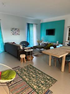 a living room with a couch and a table at Casa verde in Tuzla