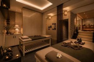 a room with two beds and a staircase at DUHORÉA Hotel and Wellness in Hanoi