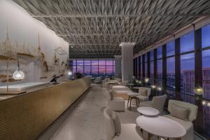a rendering of a restaurant with a view at INNSiDE by Meliá Bangkok Sukhumvit in Bangkok