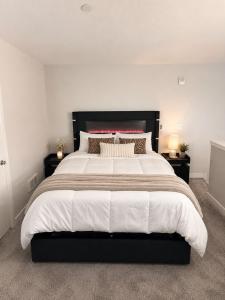 a bedroom with a large bed with two night stands at Moonlit Serenity 2 in Oakland