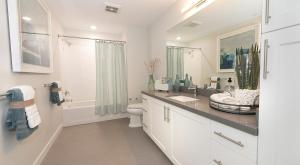 a white bathroom with a sink and a toilet at Moonlit Serenity 2 in Oakland