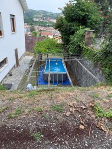 a small blue slide in a yard next to a building at Al Bricco dei Frati in Dogliani
