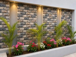 a brick wall with flowers in a window box at Palam Villa in Kharar