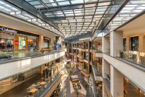 an image of a shopping mall with glass ceilings at Holiday Inn Mexico City-Plaza Universidad by IHG in Mexico City