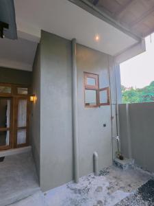 an empty room with a wall with a window at Lavera hideout in Dickwella +96 photos
