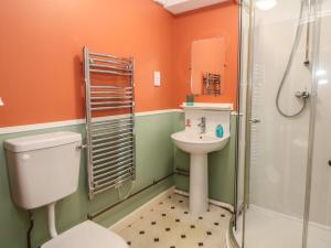 a bathroom with a toilet sink and a shower at Meadow View in Buxton +42 photos